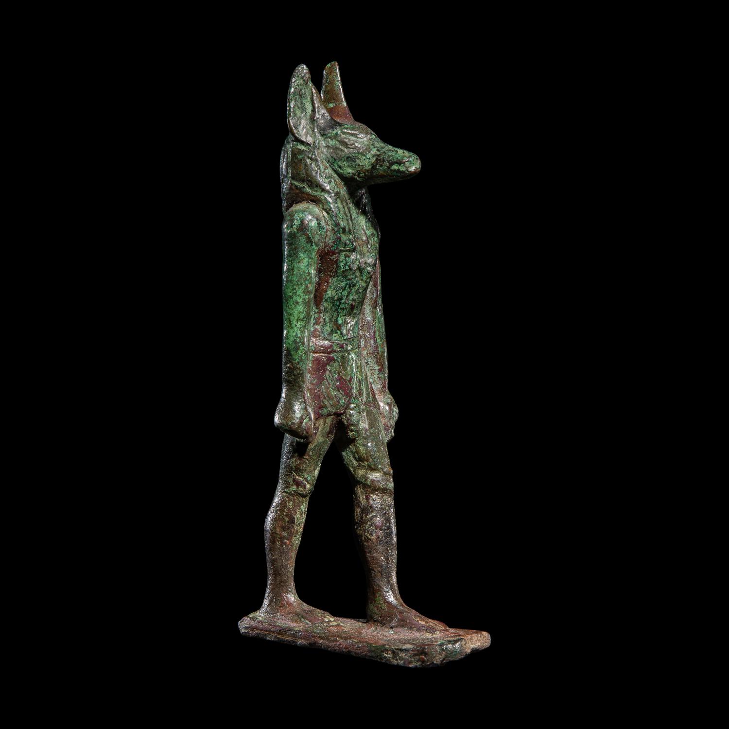 An Egyptian Bronze Striding Anubis