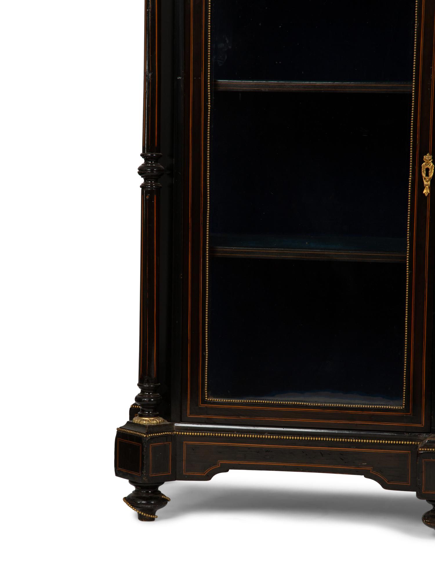 A Napoleon III Gilt Bronze and Porcelain Mounted Ebony and Marquetry Cabinet — CIRCA 1870