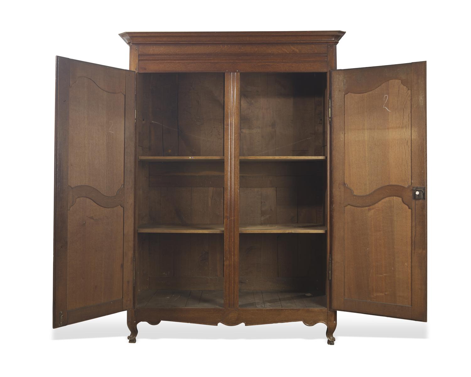 A Louis XVI carved oak armoire, circa 1790-1800