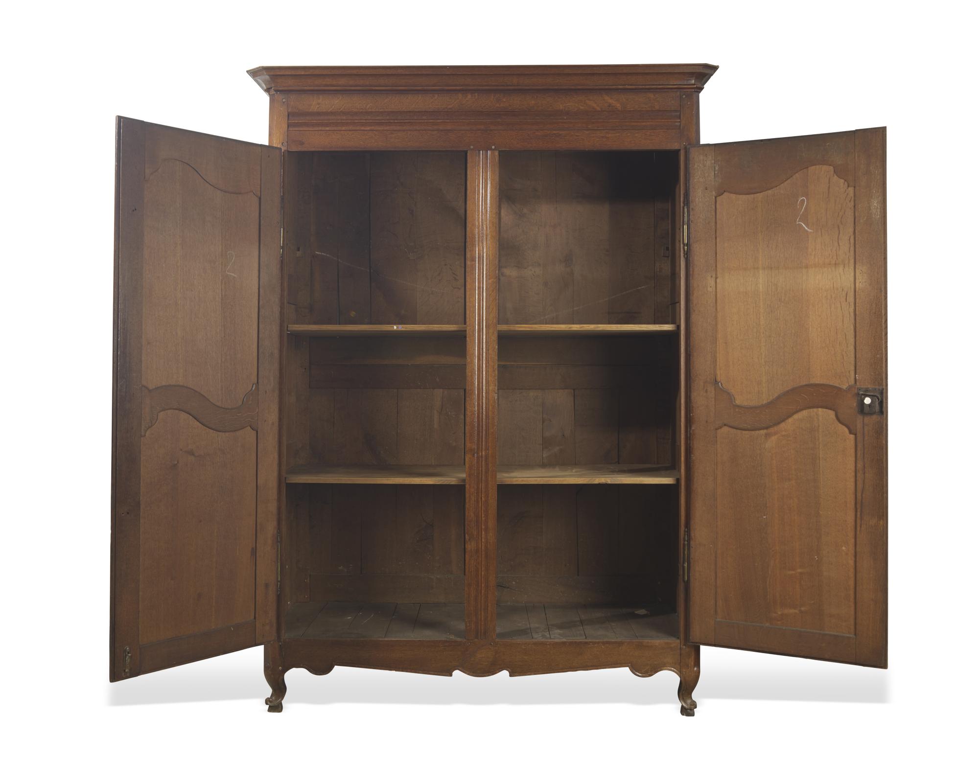 A Louis XVI carved oak armoire, circa 1790-1800