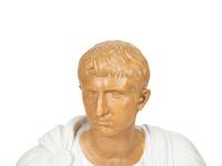 An Italian Glazed Terracotta Bust of a Roman Senator