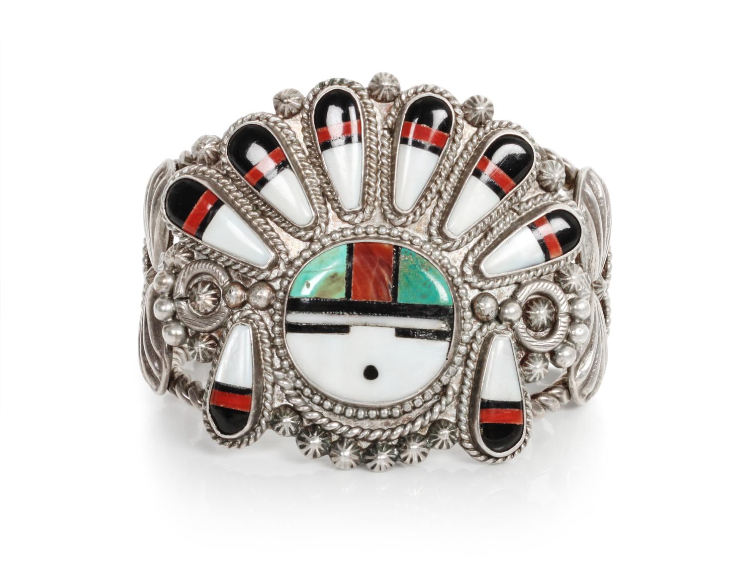 A Zuni Mosaic Sun Face Bracelet Length 5 1/4 x opening 7/8 x width 2 1/4 inches.