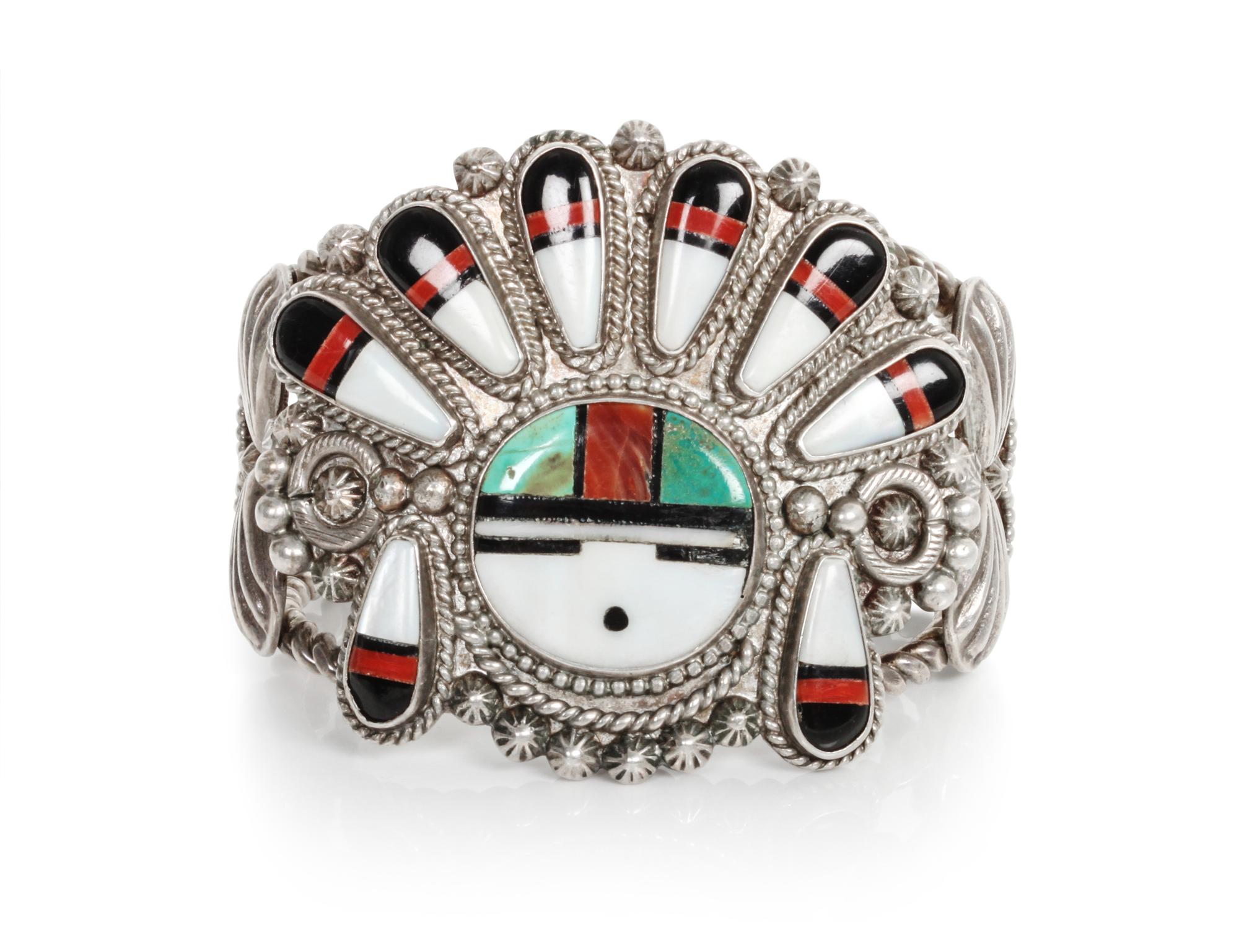 A Zuni Mosaic Sun Face Bracelet Length 5 1/4 x opening 7/8 x width 2 1/4 inches.