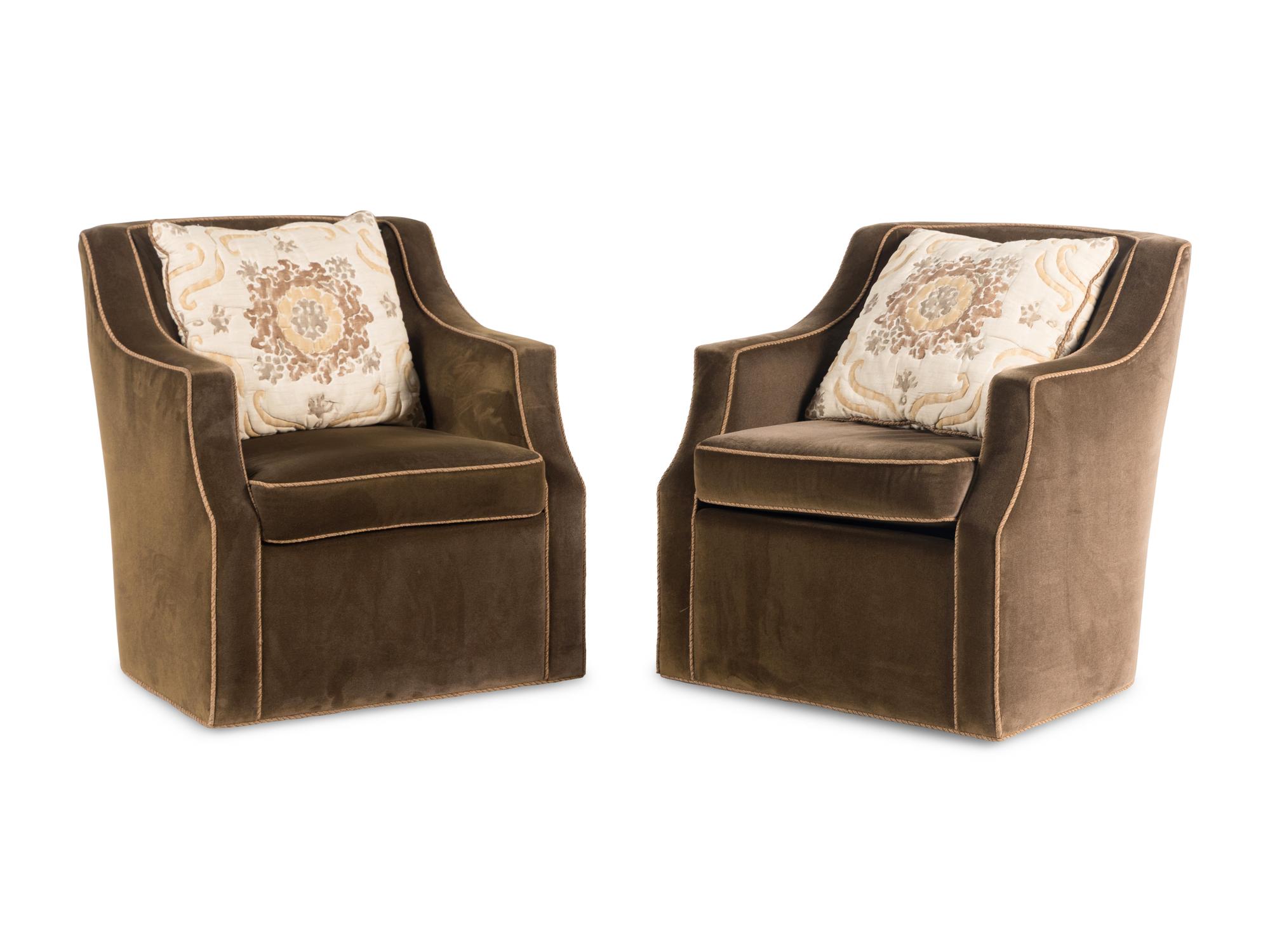 A Pair of Upholstered Swivel Club Chairs