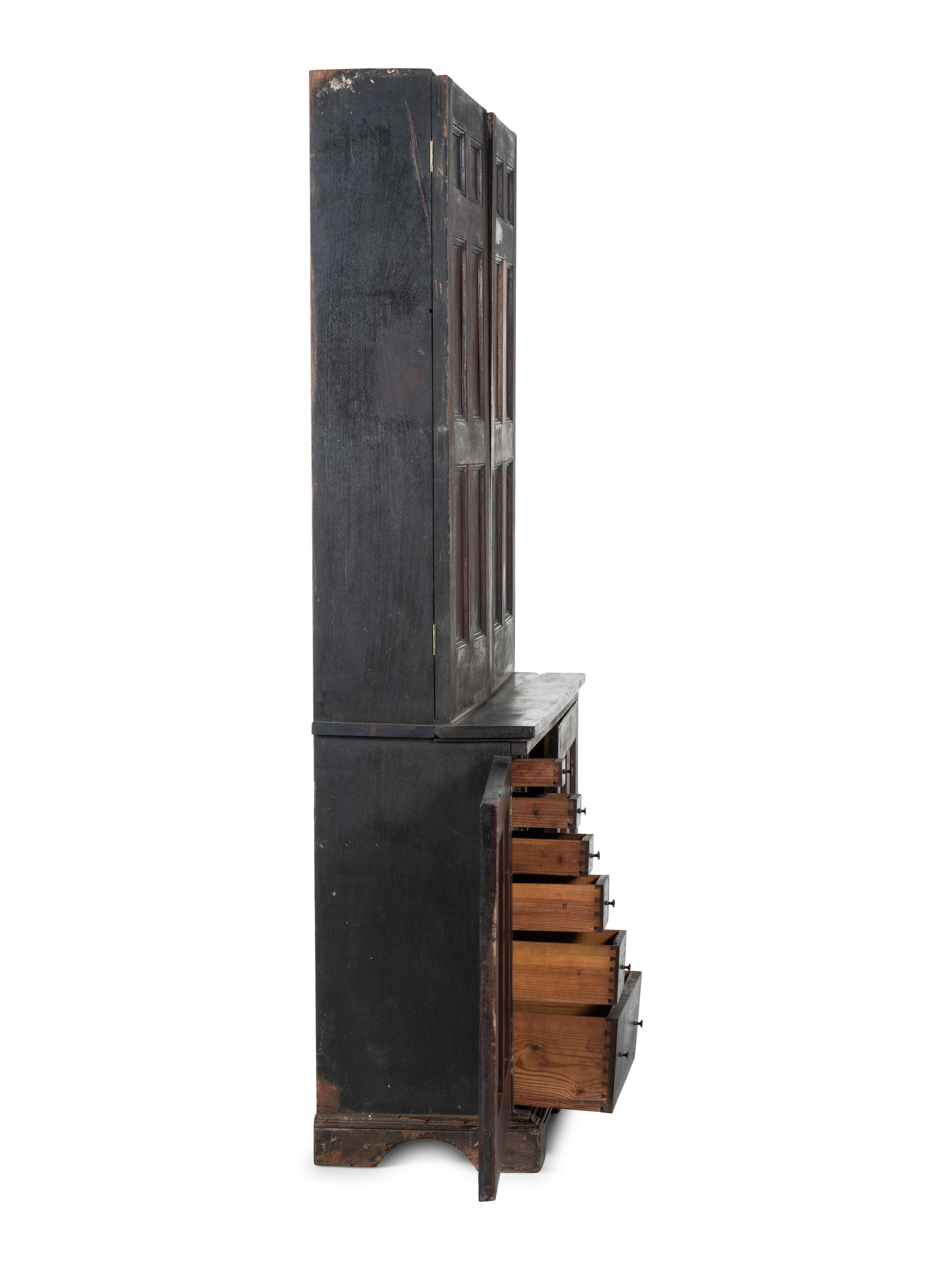 A Chippendale Style Walnut Paneled Step Back Cupboard