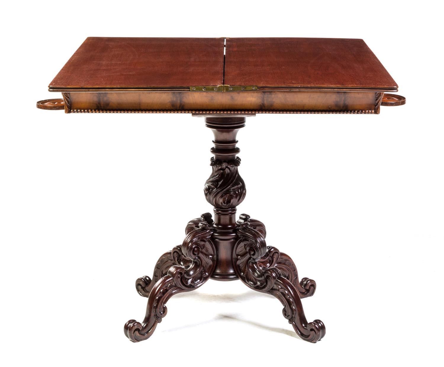 A Victorian Mahogany Flip-Top Game Table Height 30 1/4 x width 34 x depth 16 3/4 inches (closed). — 19TH CENTURY