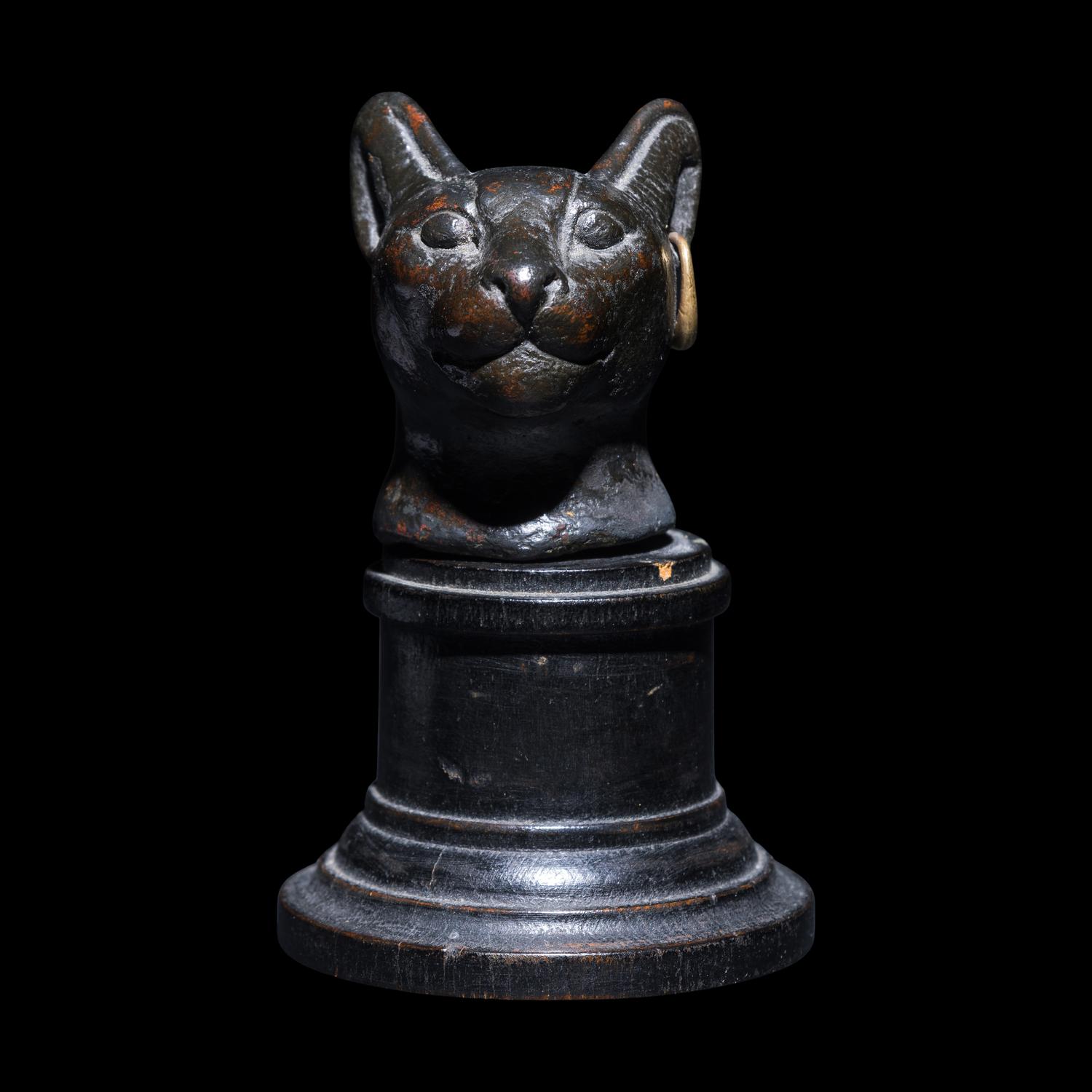 An Egyptian Bronze Head of a Cat