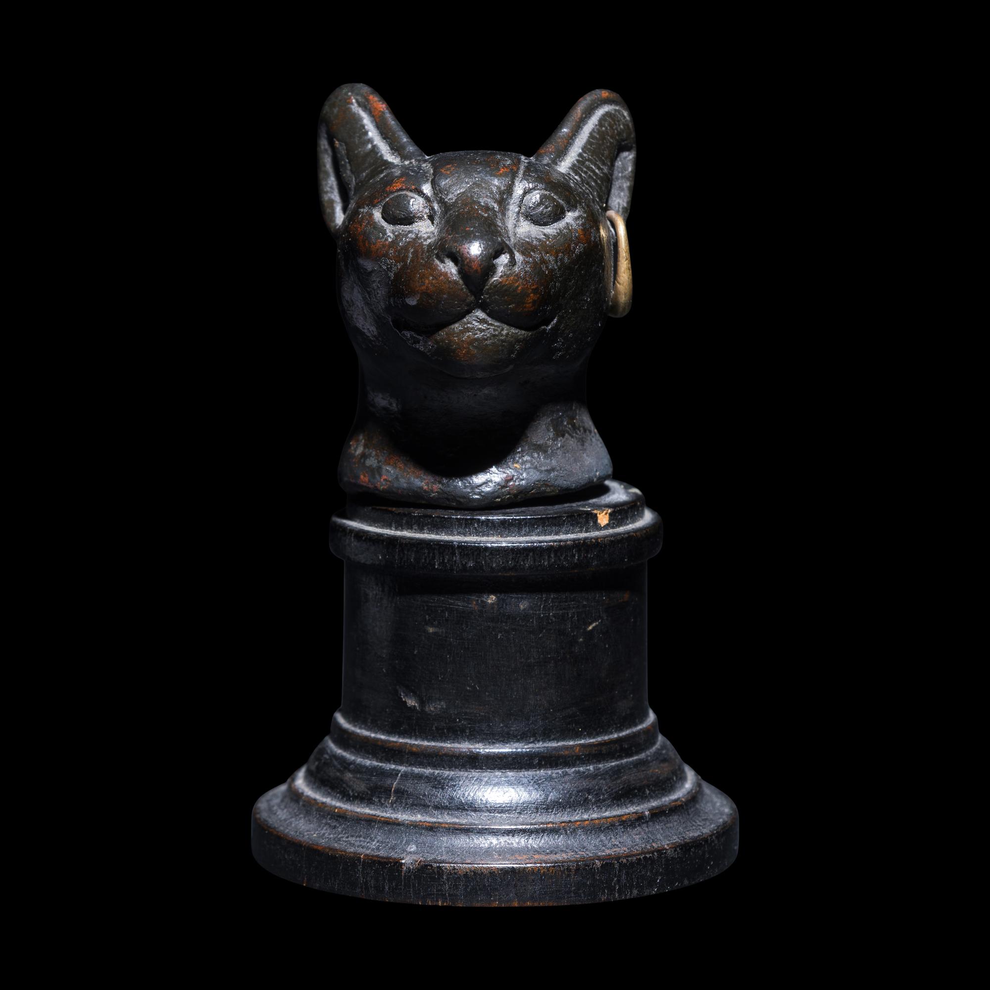 An Egyptian Bronze Head of a Cat
