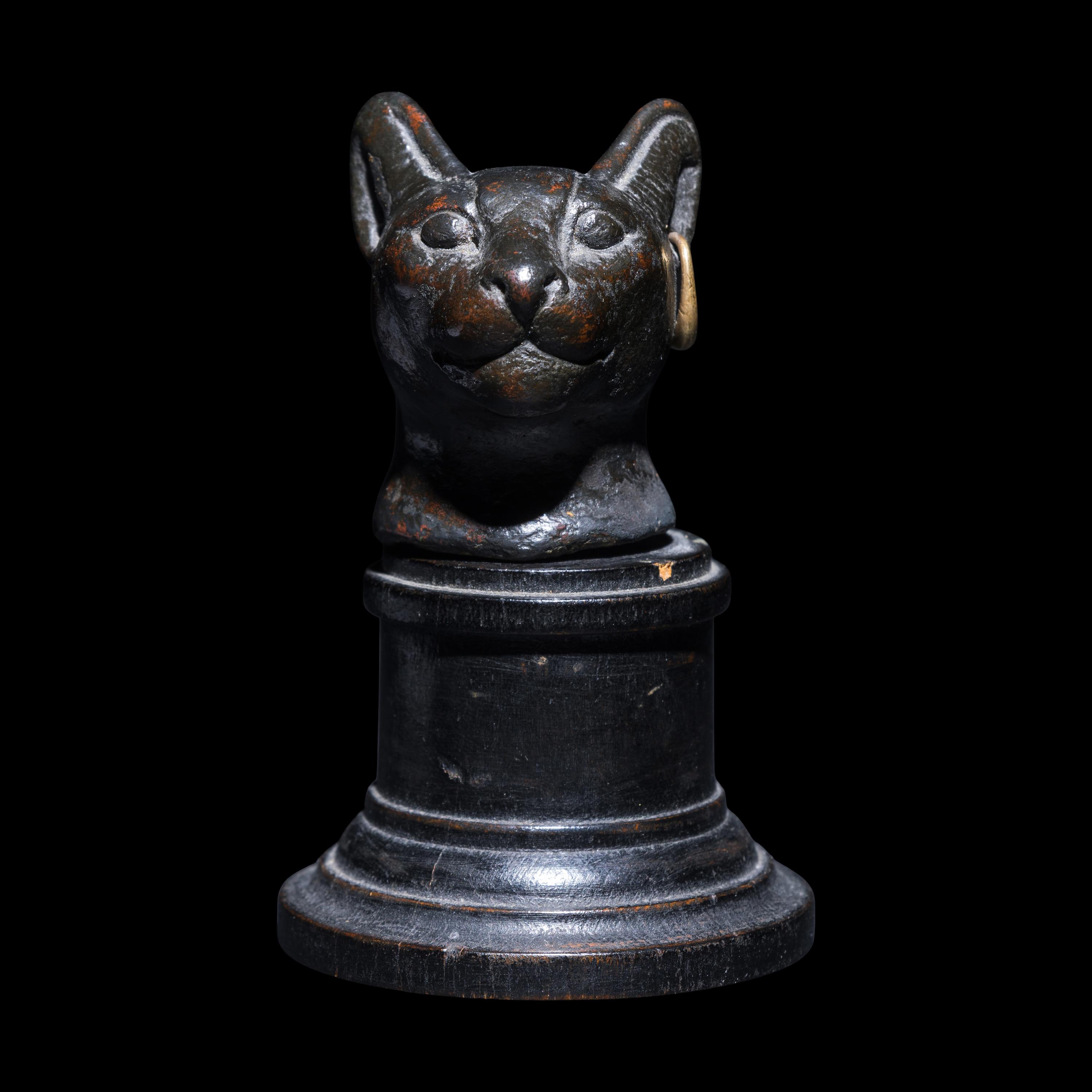 An Egyptian Bronze Head of a Cat