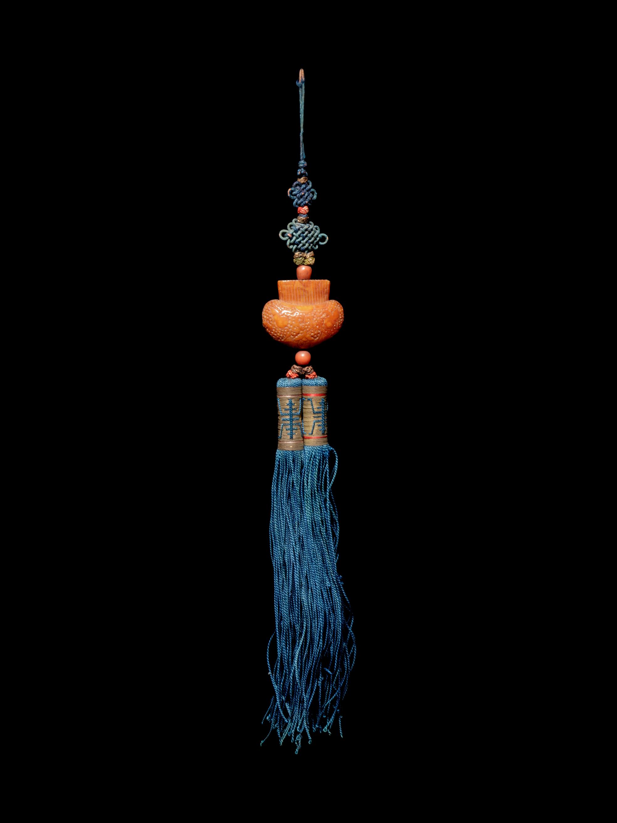 A Beewax Purse-Form Pendant