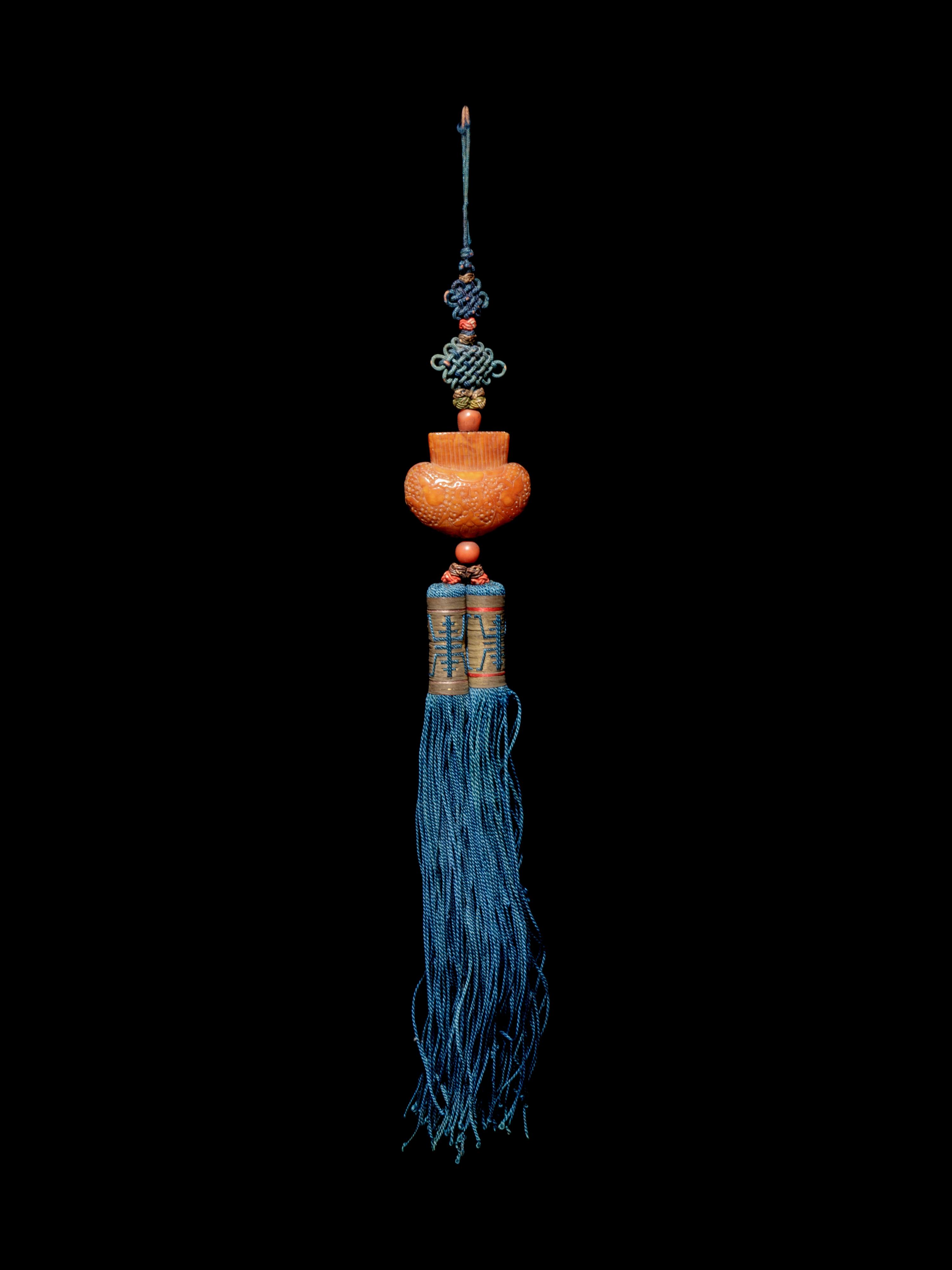 A Beewax Purse-Form Pendant