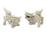 A Pair of Chinese White Glazed Porcelain Figures of Fu Lions