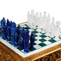 A Louis XVI Style Giltwood, Marble and Malachite Game Table with a Carved Rock Crystal and Lapis Lazuli Chess Set
