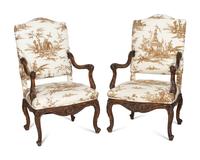 A Pair of Régence Style Walnut Fauteuils