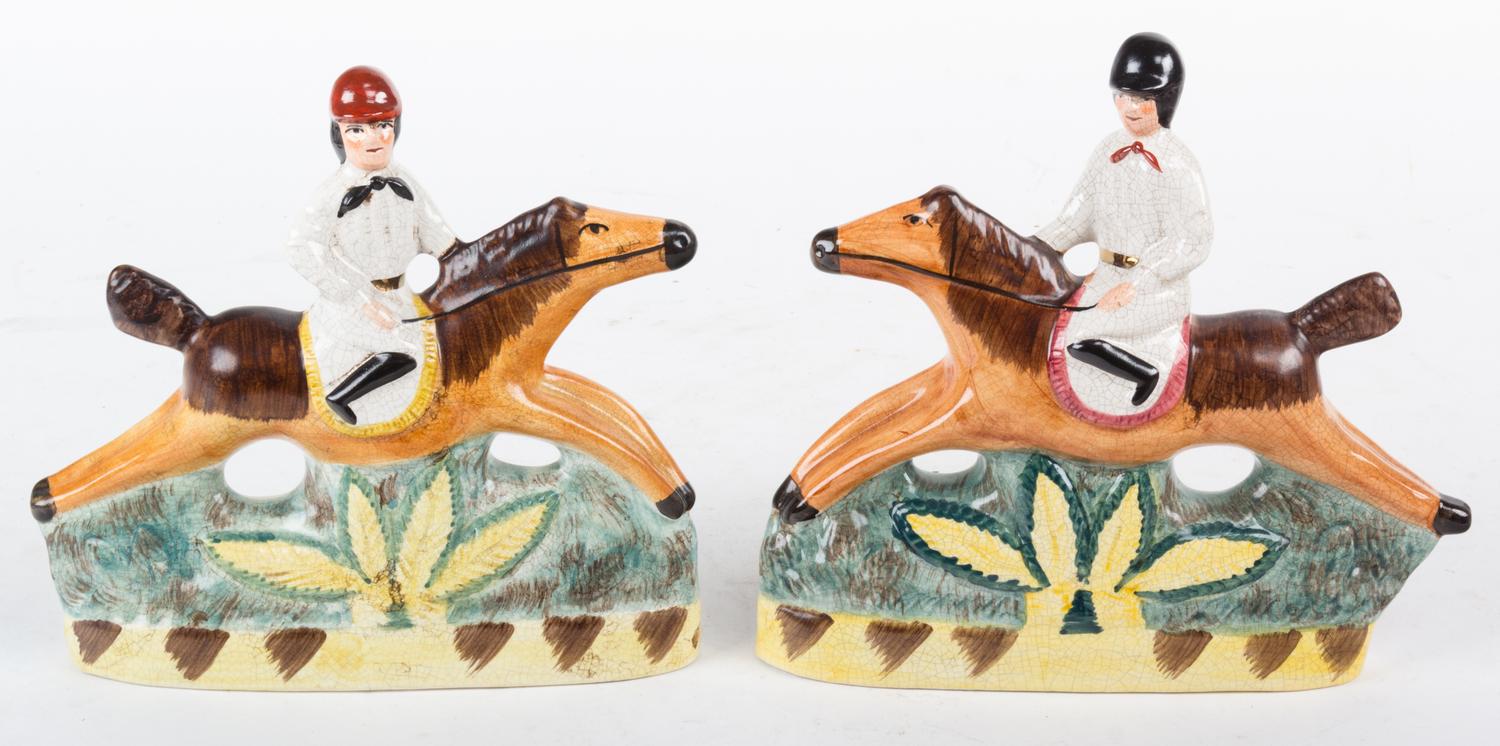 A Pair of English Ceramic Figures of Riders on Horseback Height 7 3/4 inches.