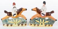 A Pair of English Ceramic Figures of Riders on Horseback Height 7 3/4 inches.