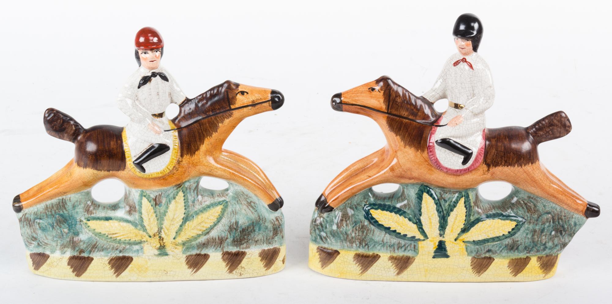 A Pair of English Ceramic Figures of Riders on Horseback Height 7 3/4 inches.