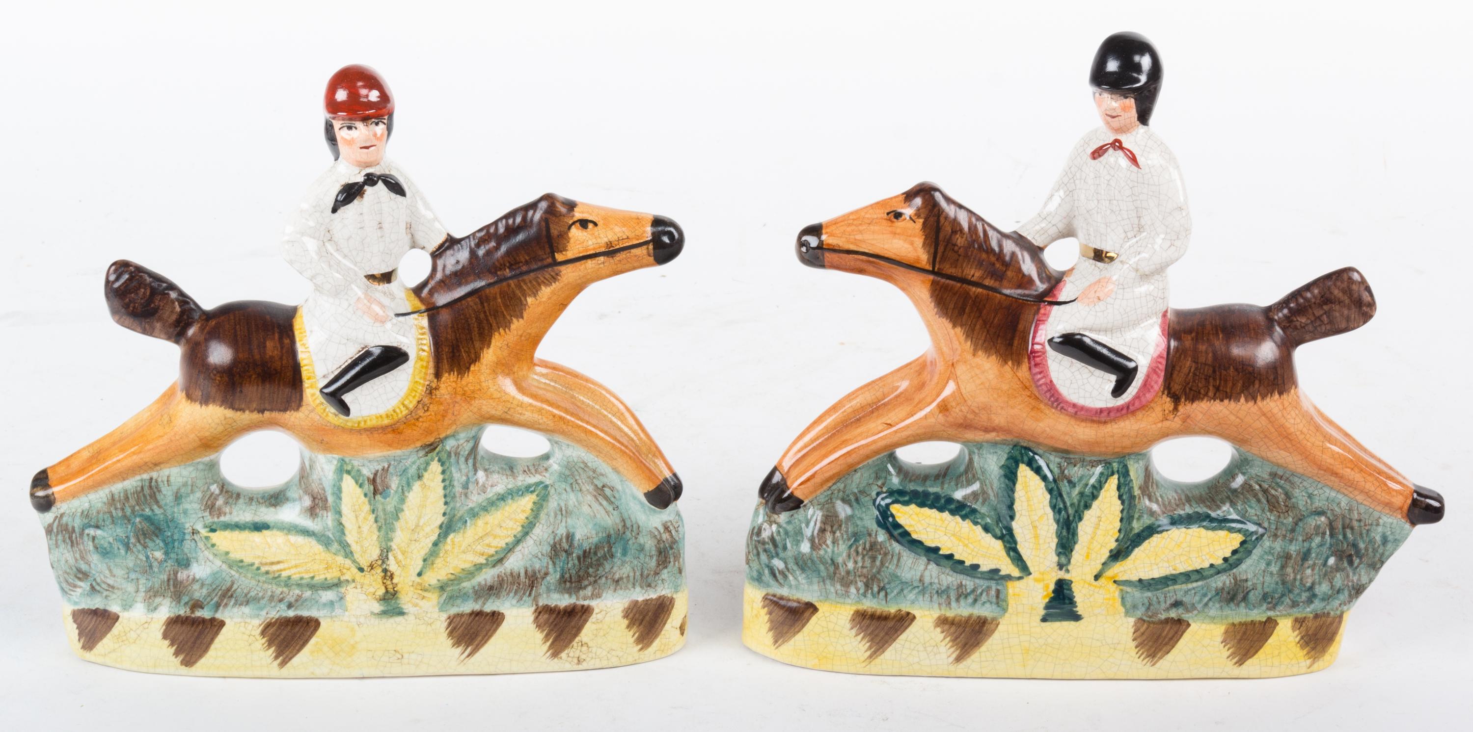 A Pair of English Ceramic Figures of Riders on Horseback Height 7 3/4 inches.