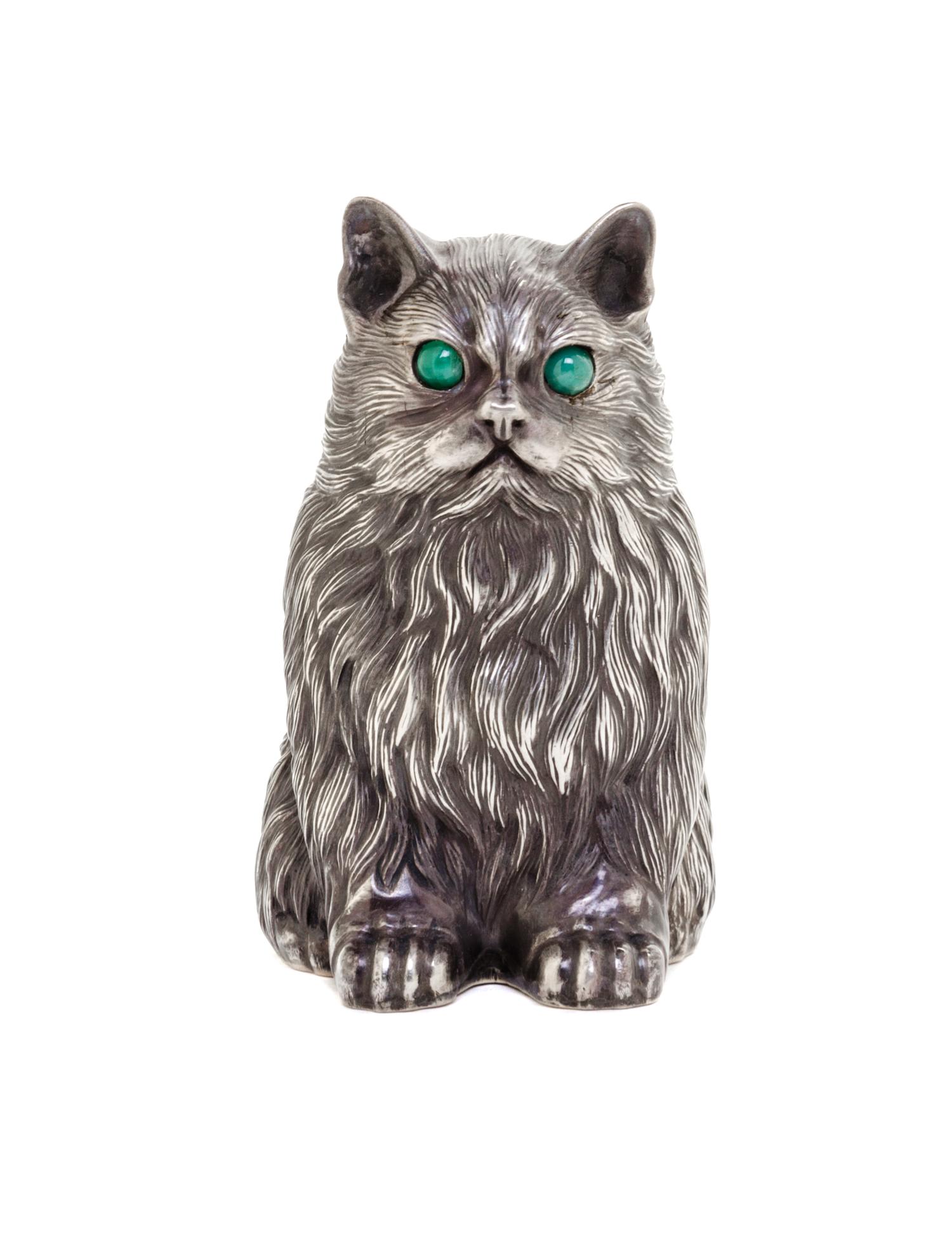 A Russian Silver Model of a Cat, Julius Rappoport, St. Petersburg, 1908-1926, depicted seated, with cabochon emerald-inset eyes.