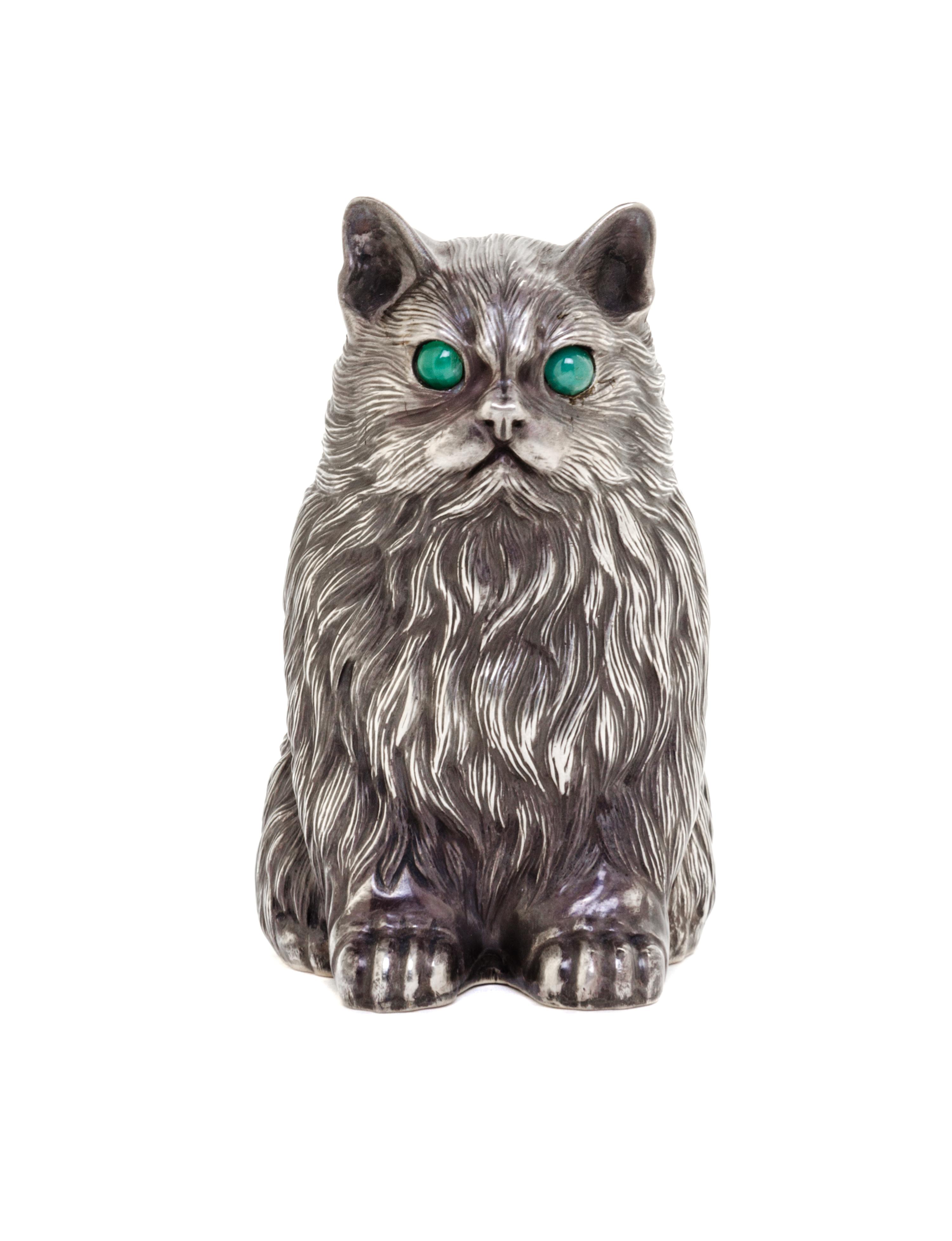 A Russian Silver Model of a Cat, Julius Rappoport, St. Petersburg, 1908-1926, depicted seated, with cabochon emerald-inset eyes.