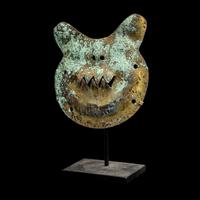 A Vicus Copper Gilt Feline Head Pendant
