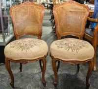 A Pair of Louis XV Style Chairs. Height of each 36 inches.