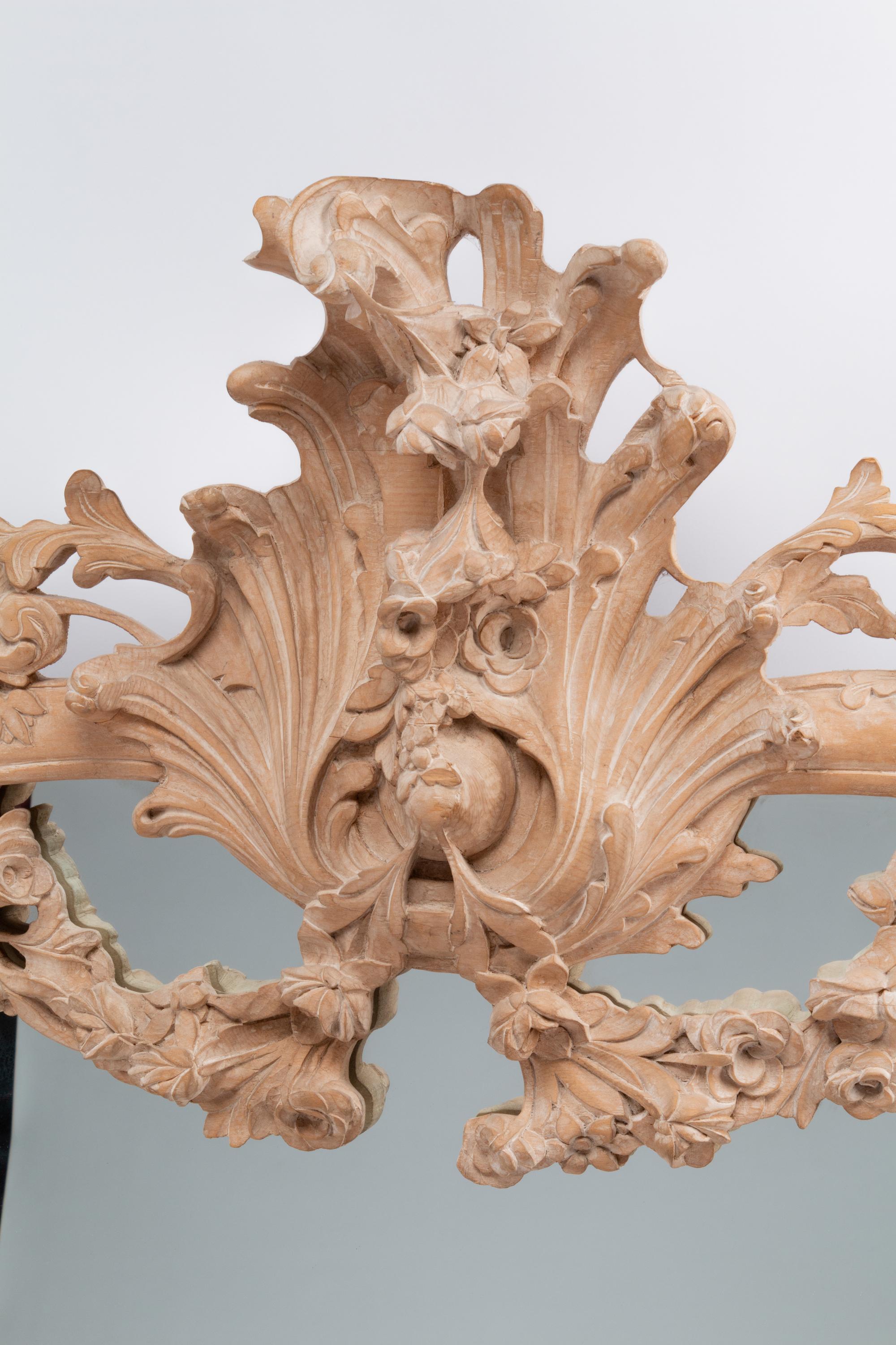 A German Rococo Style Limed Wood Overmantel Mirror