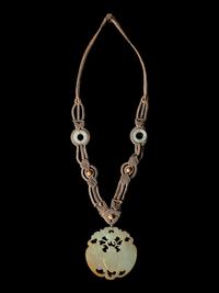 A Chinese Light Russet and Celadon Jade Pendant