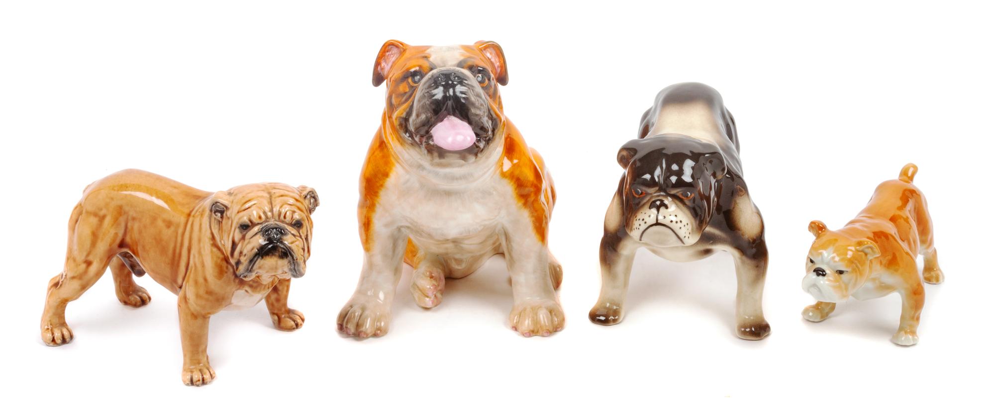 A Group of Four Porcelain Bulldogs Height of tallest 6 1/2 inches.
