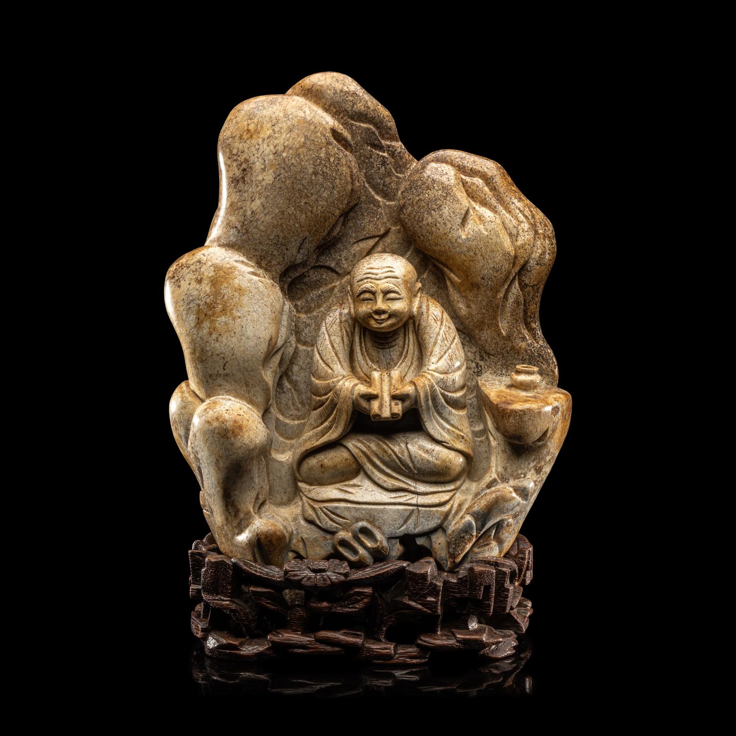 A Chinese Burnt Jade 'Luohan' Boulder 火燒玉羅漢山子