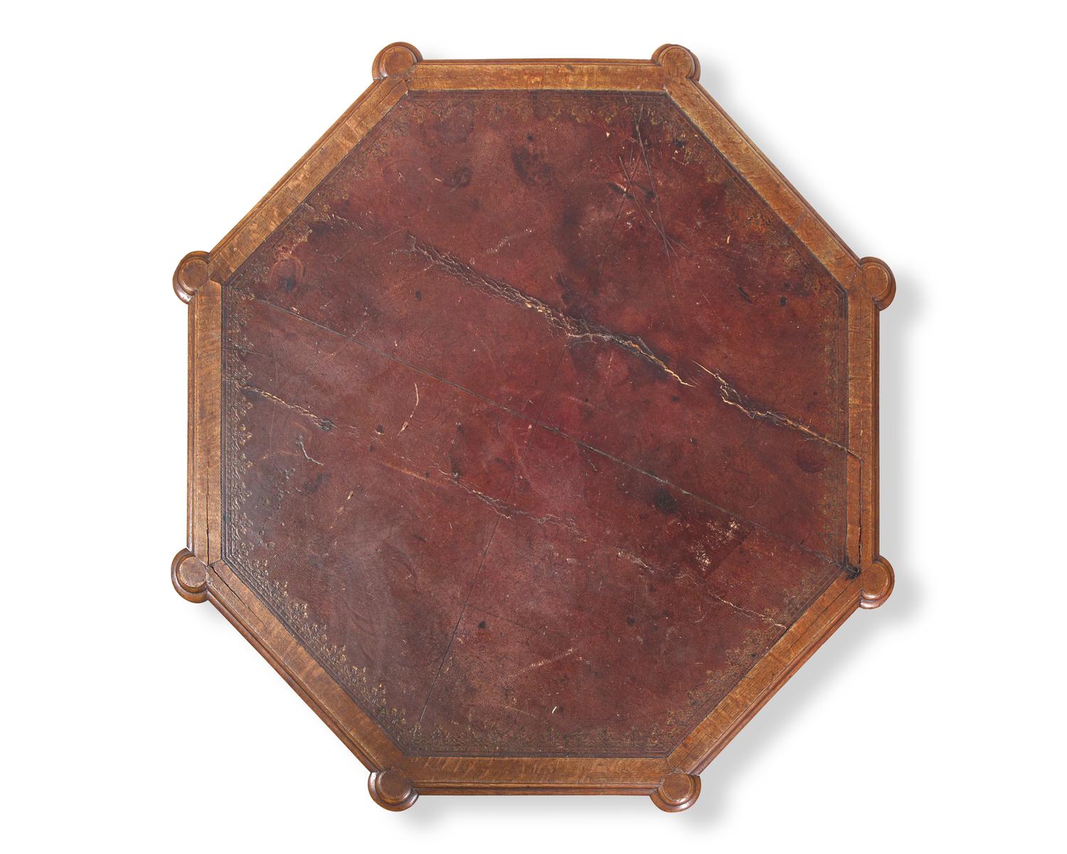 A Gothic Revival Carved Oak Center Table With Inset Leather Top