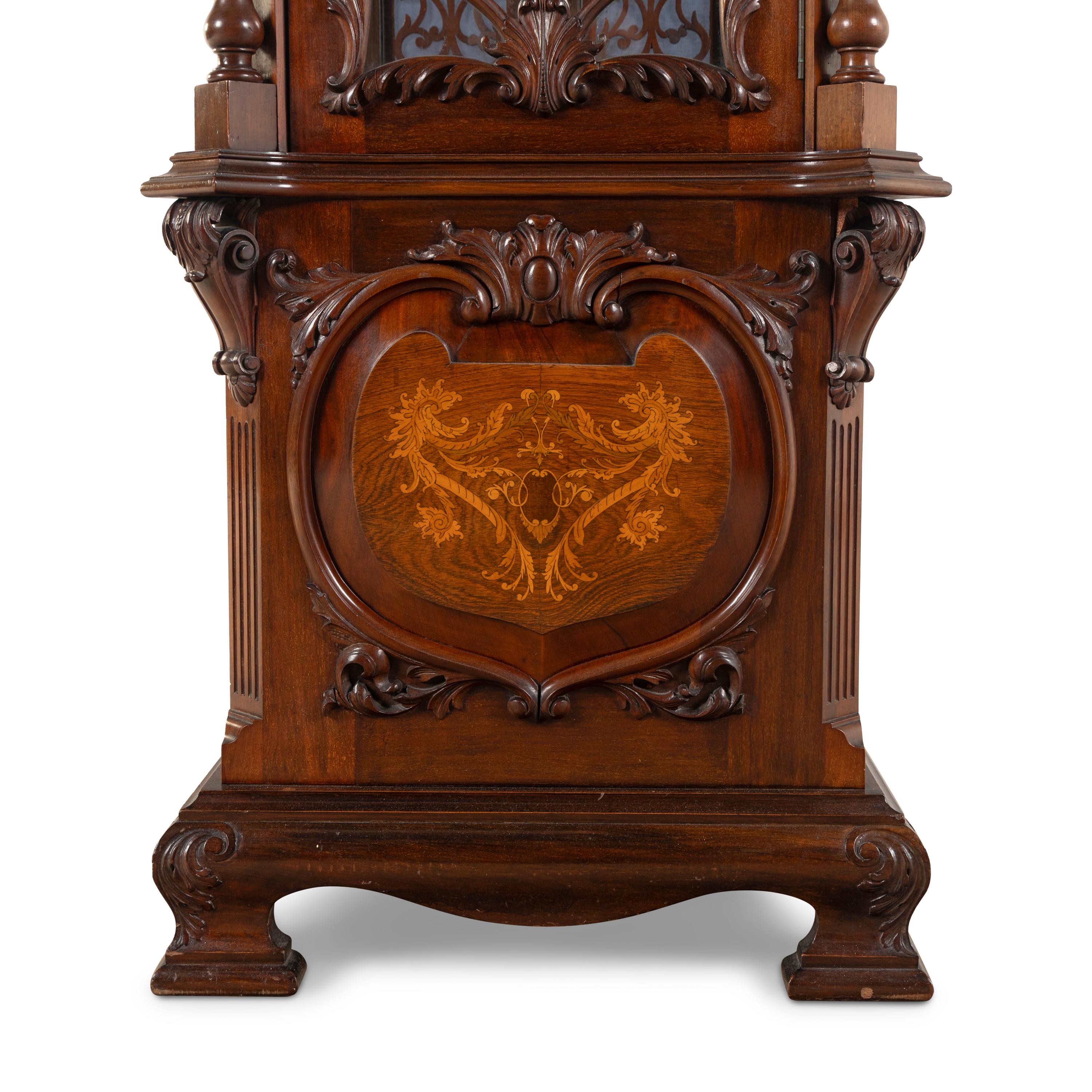 An English Carved Walnut Tall Case Clock
