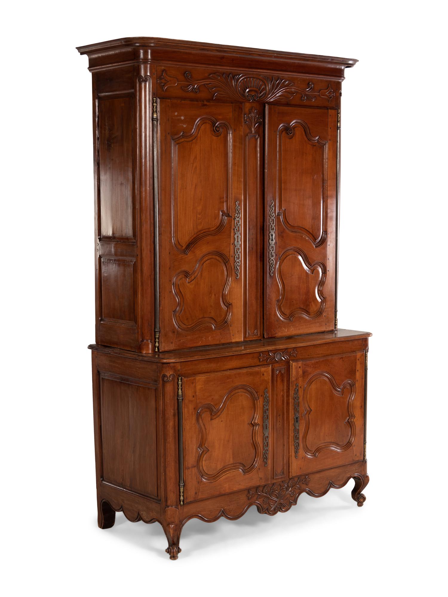 A Louis XV Provincial Cherry Stepback Cupboard