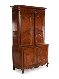 A Louis XV Provincial Cherry Stepback Cupboard