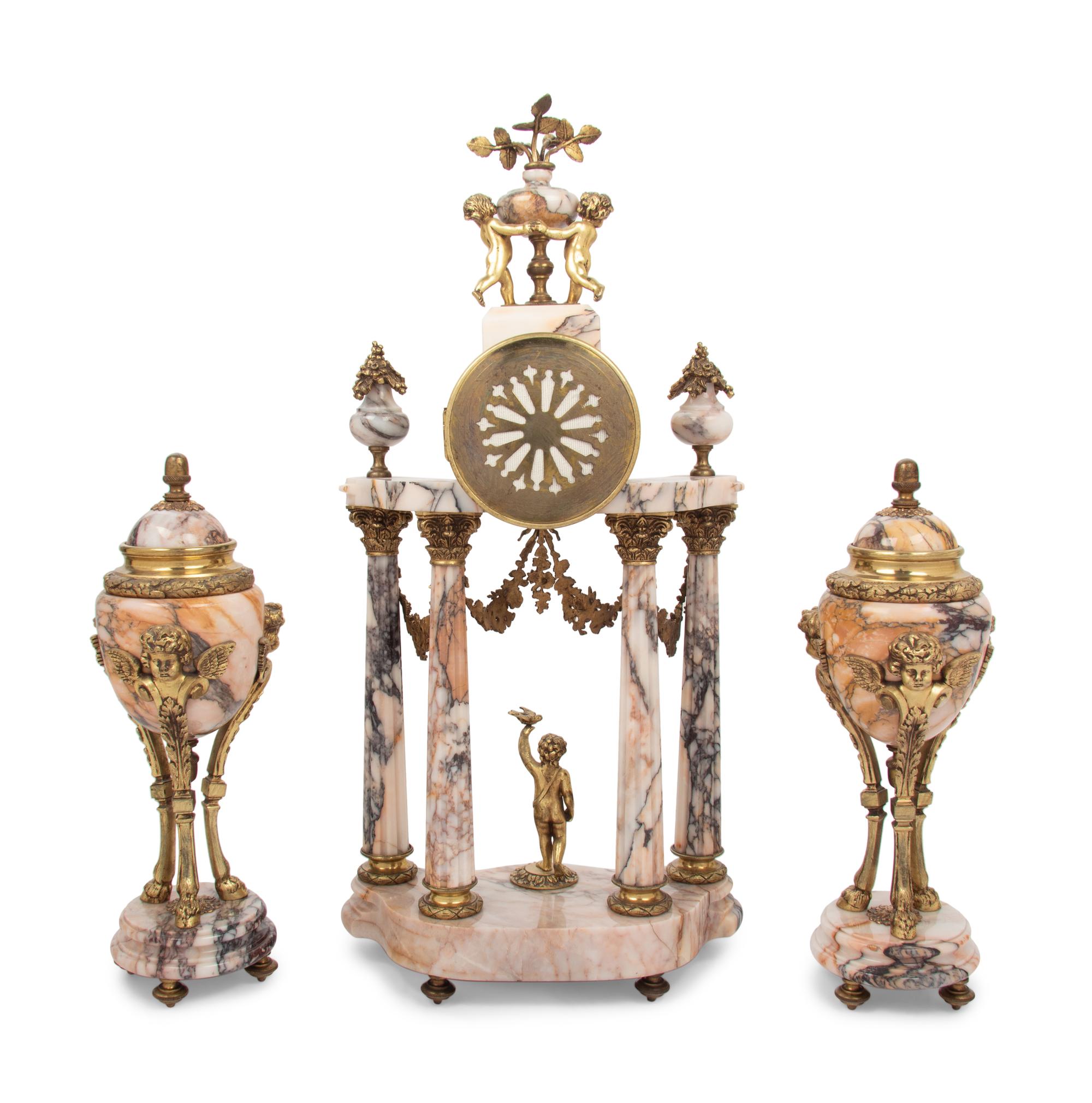 A Louis XVI Style Gilt Metal Mounted Marble Clock Garniture