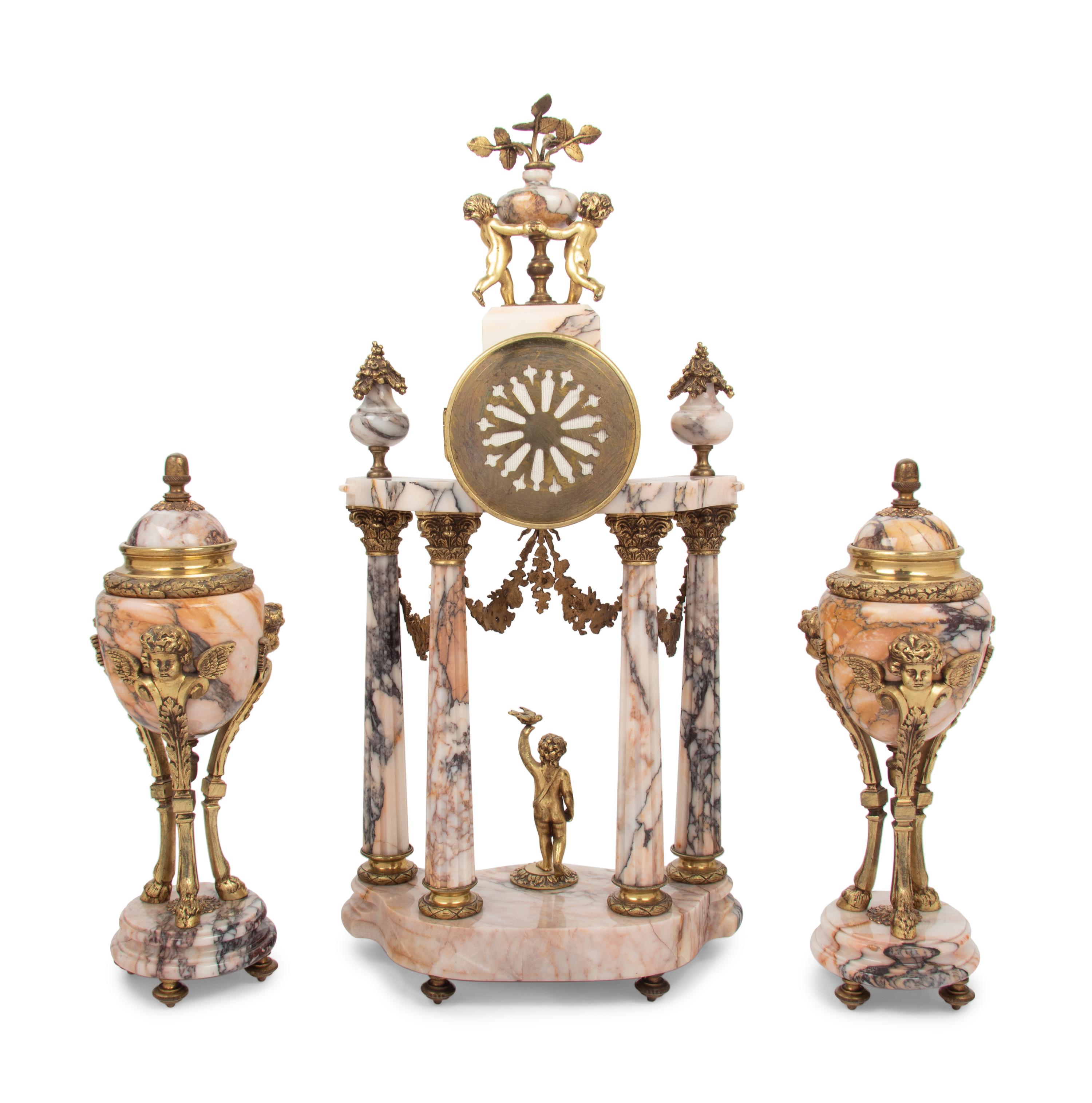 A Louis XVI Style Gilt Metal Mounted Marble Clock Garniture