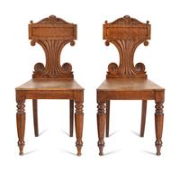 A Pair of William IV Carved Oak Hall Chairs