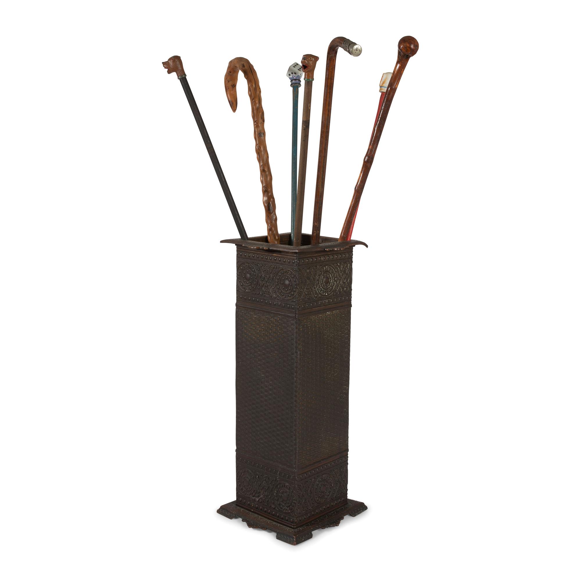 Seven Walking Sticks and a Cast Metal Umbrella Stand