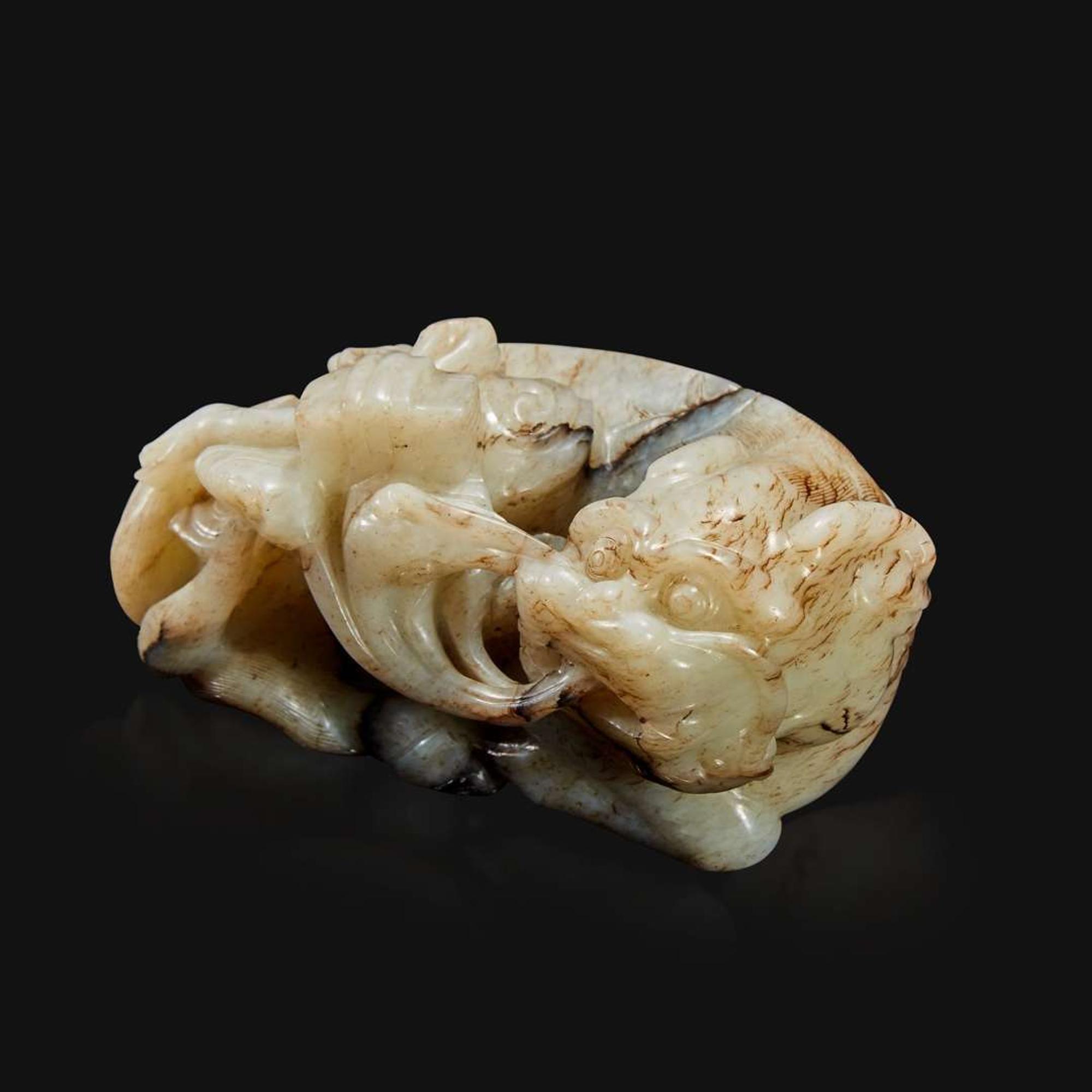 A Chinese carved jade figure of recumbent qilin