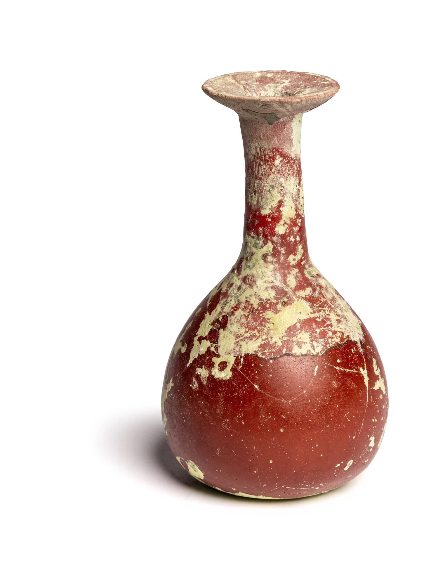 A Hellenistic or Roman Opaque Dark Red Glass Bottle