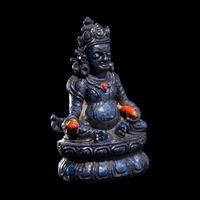A Sino-Tibetan Carved Lapis Lazuli Figure of Jambhalā