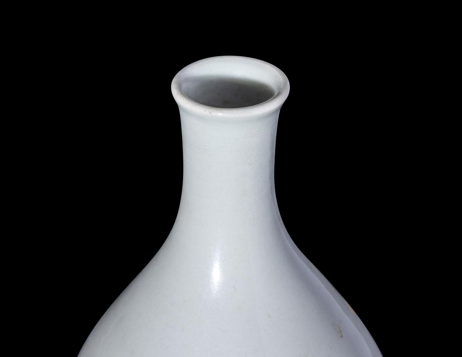 A Chinese Carved White Glazed Porcelain Bottle Vase
