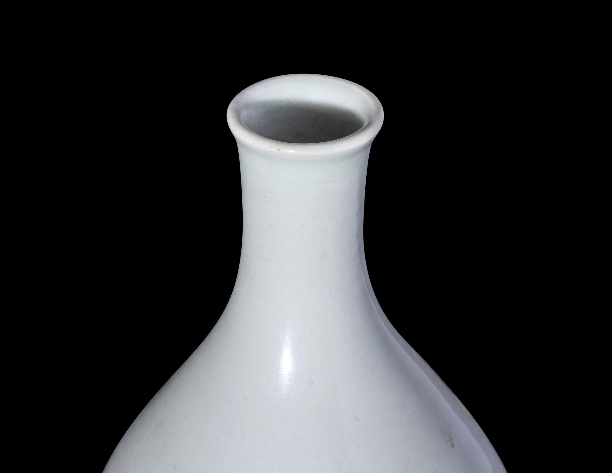 A Chinese Carved White Glazed Porcelain Bottle Vase