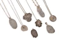 An Assortment Navajo Silver, Coral, and Turquoise Pendants