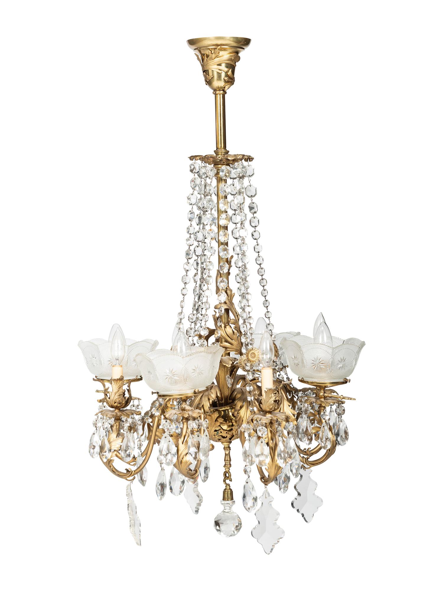 A Gilt Metal Eight Light Chandelier with Etched Glass Shades