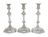 A Set of Three George III Silver Candlesticks