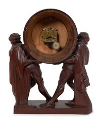 A Continental Carved Oak Figural Clock