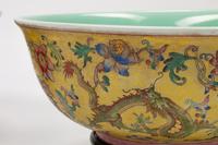 A Pair of Chinese Export Famille Jaune Porcelain Bowls with Wood Bases