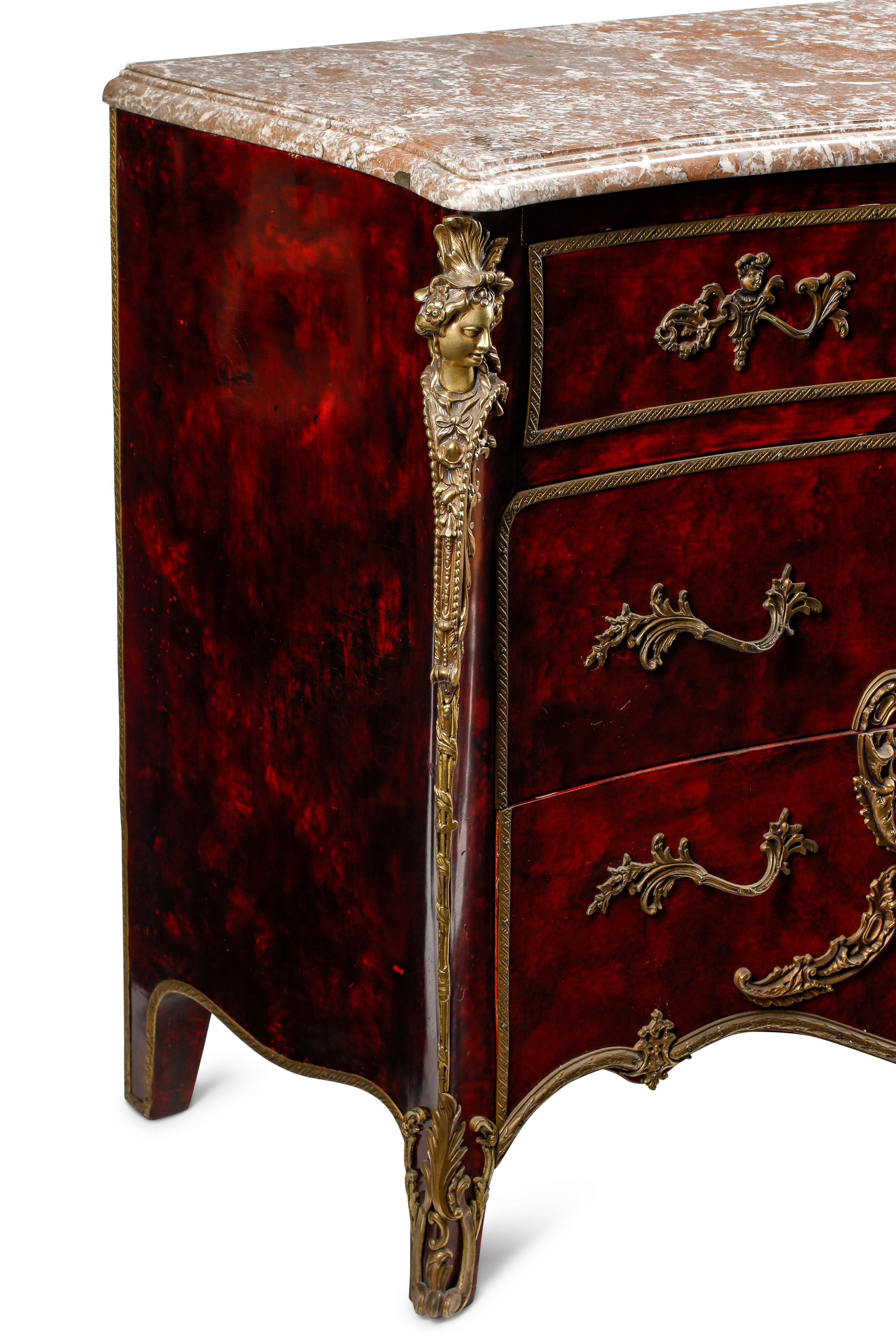 A Louis XV Style Faux Shell-Painted and Gilt Bronze Mounted Commode