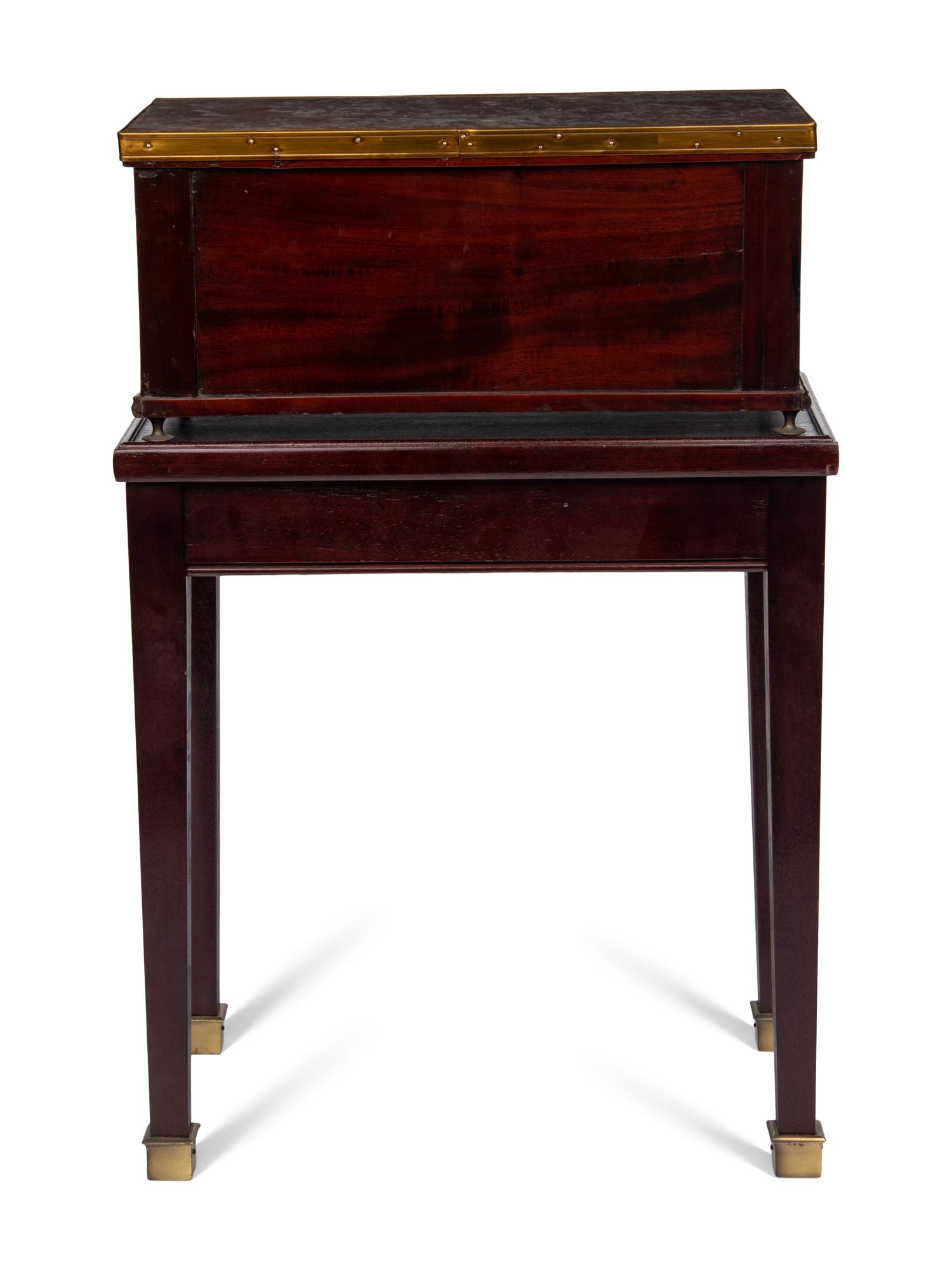 A Directoire Style Mahogany Marble-Top Chest on a Stand